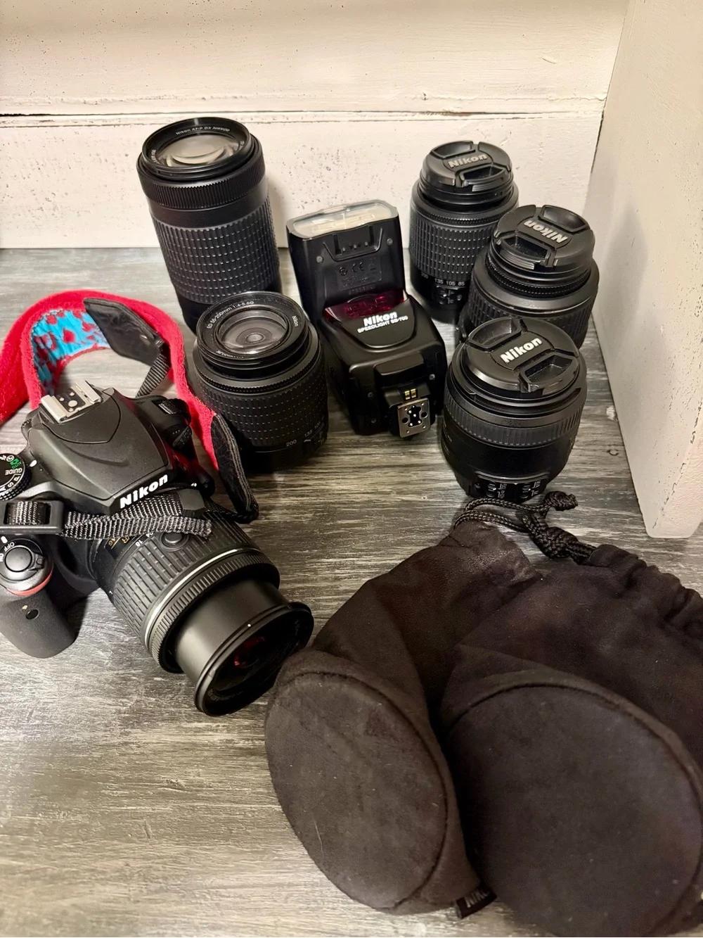 Nikon Camera Kit with Black Lenses and Red Strap